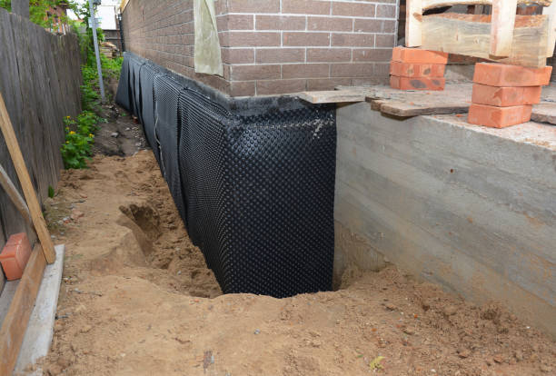 SJ Waterproofing Pros technician performing targeted Exterior Waterproofing assessment in Nekoosa, WI